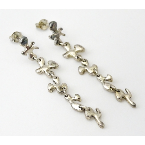 760 - A pair of silver drop earrings. Approx. 2