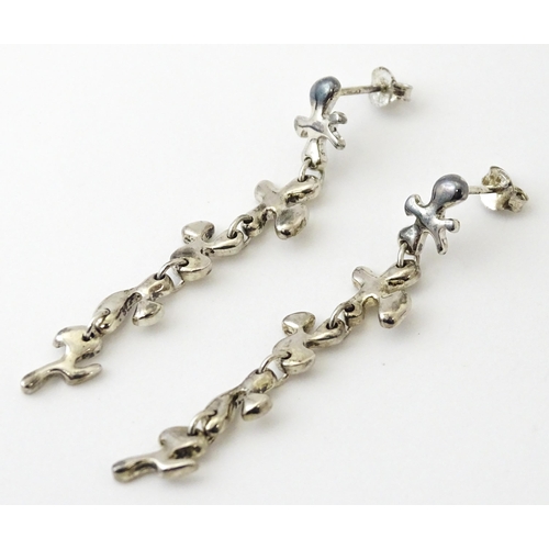 760 - A pair of silver drop earrings. Approx. 2