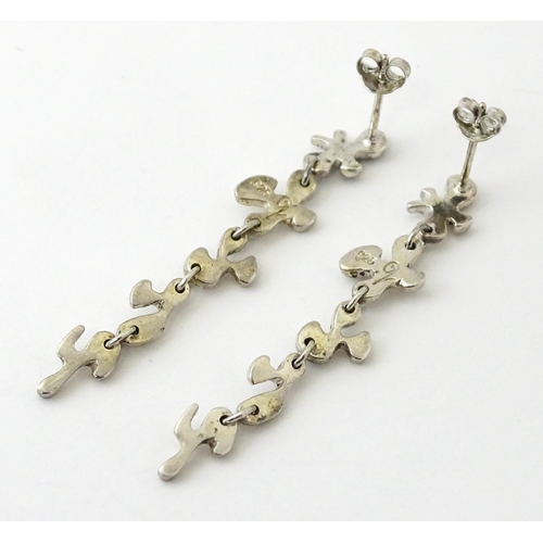 760 - A pair of silver drop earrings. Approx. 2