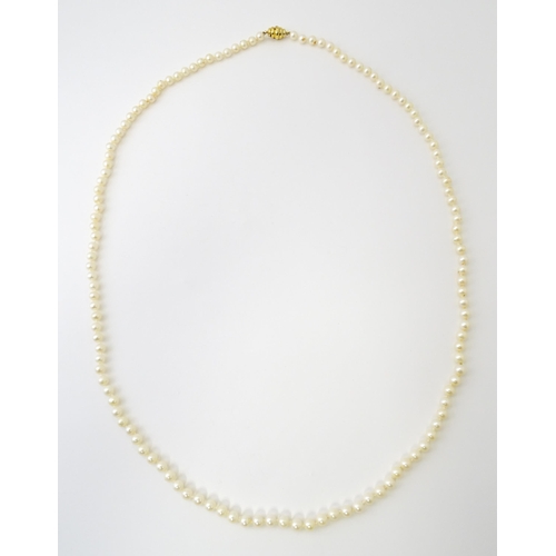 761 - A long pearl necklace. Approx. 35