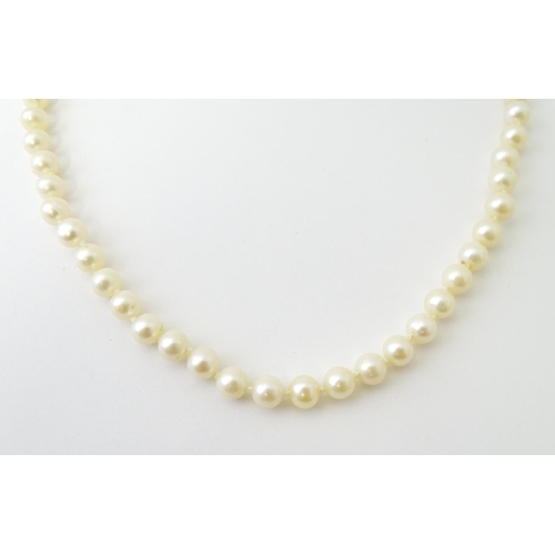 761 - A long pearl necklace. Approx. 35