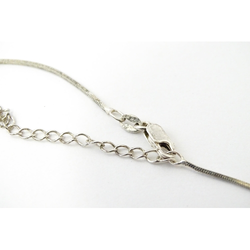 772 - A large quantity of silver and white metal necklaces, pendants etc.