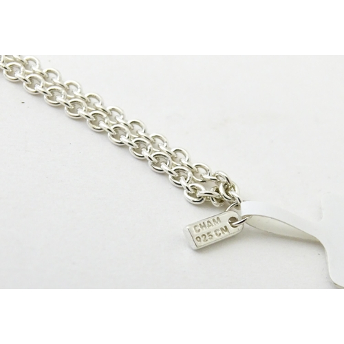 772 - A large quantity of silver and white metal necklaces, pendants etc.