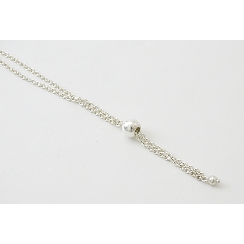 772 - A large quantity of silver and white metal necklaces, pendants etc.