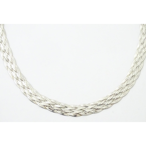 772 - A large quantity of silver and white metal necklaces, pendants etc.