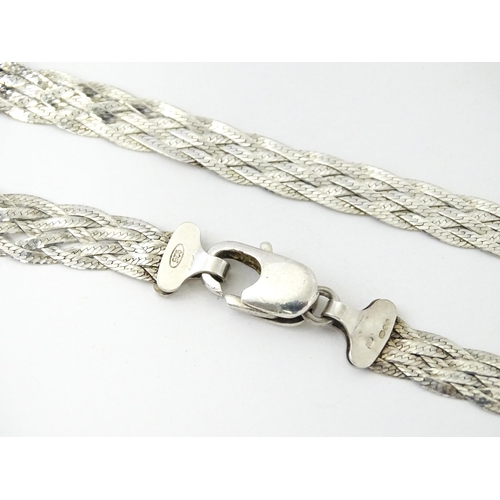 772 - A large quantity of silver and white metal necklaces, pendants etc.