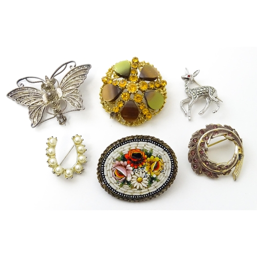 776 - A quantity of assorted vintage brooches to include one formed as a Continental silver butterfly with... 