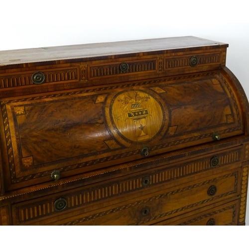 1454 - A 19thC continental desk with a roll top front having satinwood marquetry decoration alongside decor... 