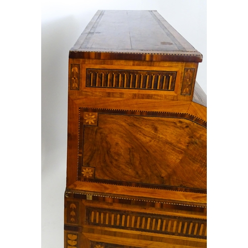 1454 - A 19thC continental desk with a roll top front having satinwood marquetry decoration alongside decor... 