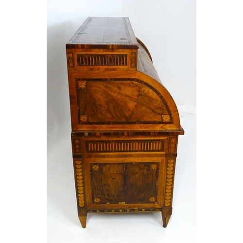 1454 - A 19thC continental desk with a roll top front having satinwood marquetry decoration alongside decor... 