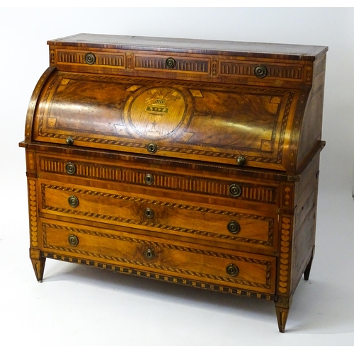 1454 - A 19thC continental desk with a roll top front having satinwood marquetry decoration alongside decor... 