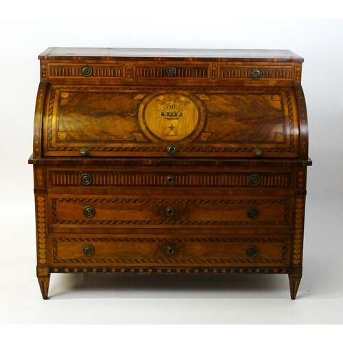 1454 - A 19thC continental desk with a roll top front having satinwood marquetry decoration alongside decor... 