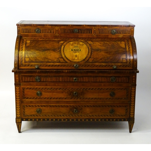 1454 - A 19thC continental desk with a roll top front having satinwood marquetry decoration alongside decor... 