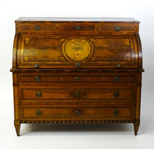 1454 - A 19thC continental desk with a roll top front having satinwood marquetry decoration alongside decor... 