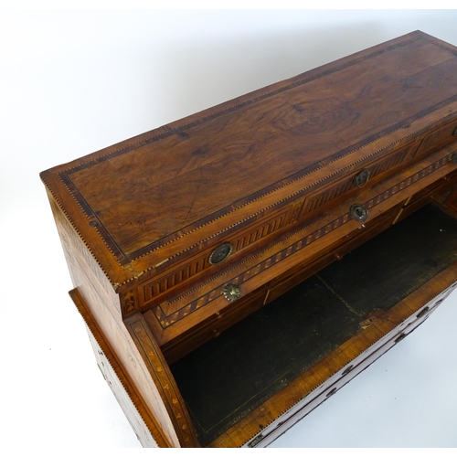 1454 - A 19thC continental desk with a roll top front having satinwood marquetry decoration alongside decor... 