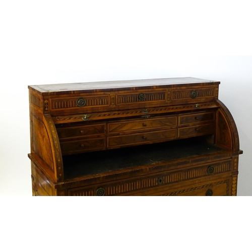 1454 - A 19thC continental desk with a roll top front having satinwood marquetry decoration alongside decor... 