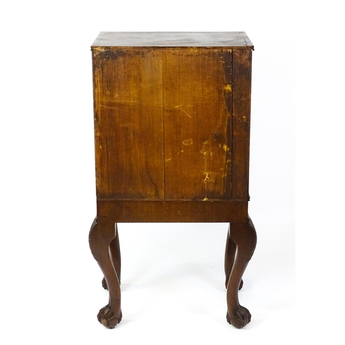 1495 - A 19thC mahogany Irish collectors cabinet with two panelled cupboard doors concealing twelve short d... 