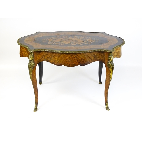 1509 - A 19thC centre table with a marquetry inlaid top above a brass moulded rim and inlaid frieze, the ta... 