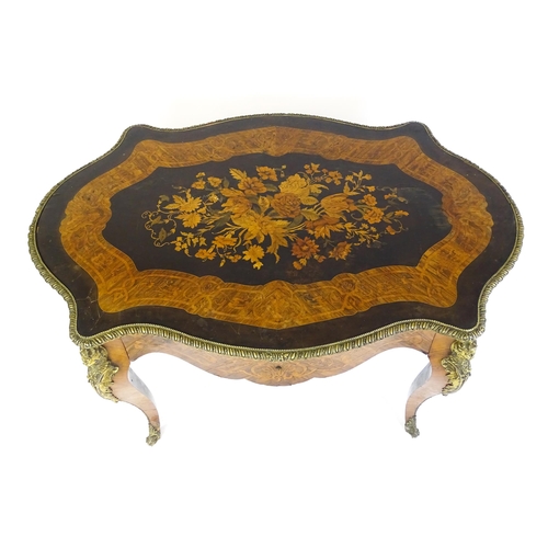 1509 - A 19thC centre table with a marquetry inlaid top above a brass moulded rim and inlaid frieze, the ta... 