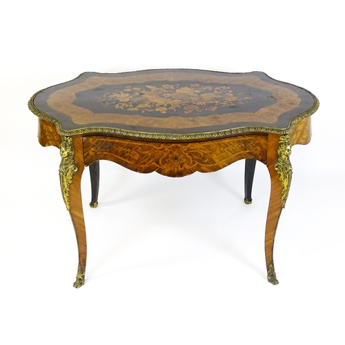 1509 - A 19thC centre table with a marquetry inlaid top above a brass moulded rim and inlaid frieze, the ta... 