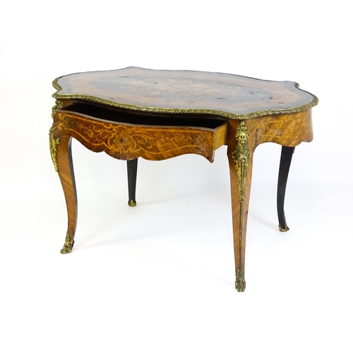 1509 - A 19thC centre table with a marquetry inlaid top above a brass moulded rim and inlaid frieze, the ta... 