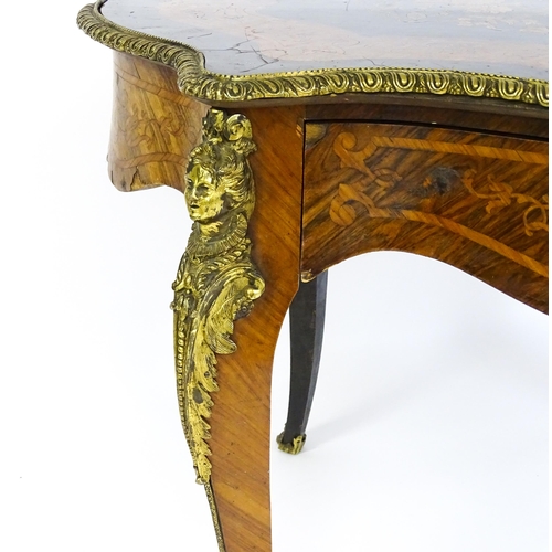 1509 - A 19thC centre table with a marquetry inlaid top above a brass moulded rim and inlaid frieze, the ta... 