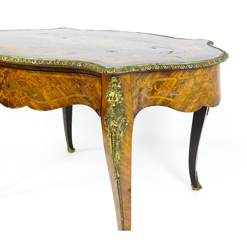 1509 - A 19thC centre table with a marquetry inlaid top above a brass moulded rim and inlaid frieze, the ta... 