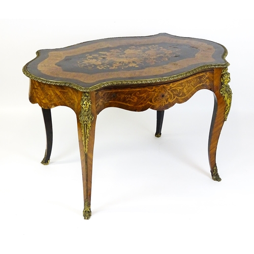 1509 - A 19thC centre table with a marquetry inlaid top above a brass moulded rim and inlaid frieze, the ta... 