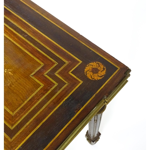 1513 - A 19thC card table with a marquetry inlaid cornucopia to the top and brass mouldings to the rim. The... 