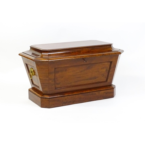 1533 - An early 19thC mahogany wine cooler of sarcophagus form with a moulded hinged lid above a panelled f... 