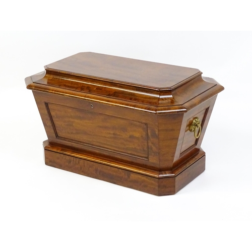 1533 - An early 19thC mahogany wine cooler of sarcophagus form with a moulded hinged lid above a panelled f... 