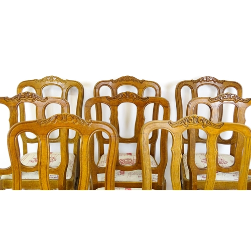 1578 - A set of eight oak French Louis XV style chairs with carved cresting rails, with drop in seats and r... 