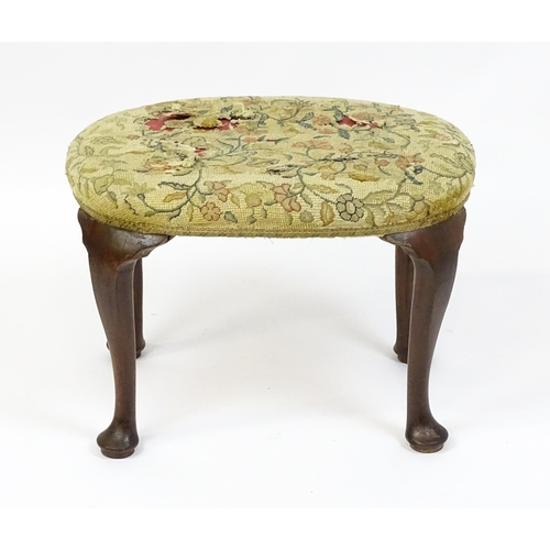 1589 - A Queen Anne stool raised on four cabriole legs terminating in pad feet. 23