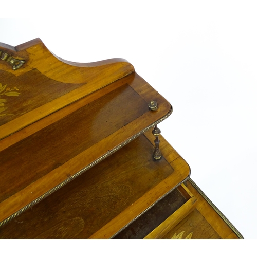 1607 - A 19thC mahogany Bonheur du jour with a shaped and mirrored upstand having marquetry decoration matc... 