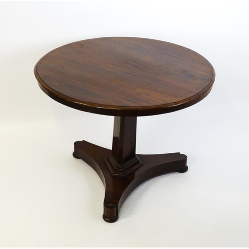 1621 - A Victorian mahogany pedestal table with a circular moulded top above a canted pedestal and triform ... 