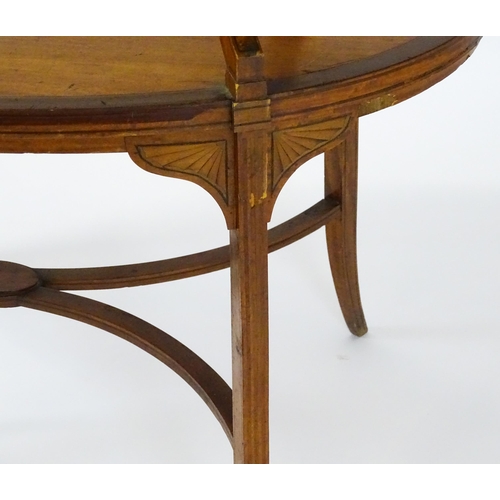 1623 - A late 19thC satinwood etagere with two oval crossbanded tiers raised on four splayed legs united by... 