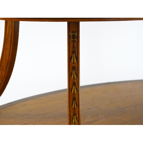 1623 - A late 19thC satinwood etagere with two oval crossbanded tiers raised on four splayed legs united by... 