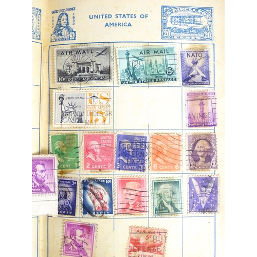 1972 - A quantity of late 19thC and later worldwide postage stamps within albums, together with a loose exa... 