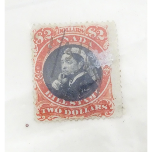 1972 - A quantity of late 19thC and later worldwide postage stamps within albums, together with a loose exa... 