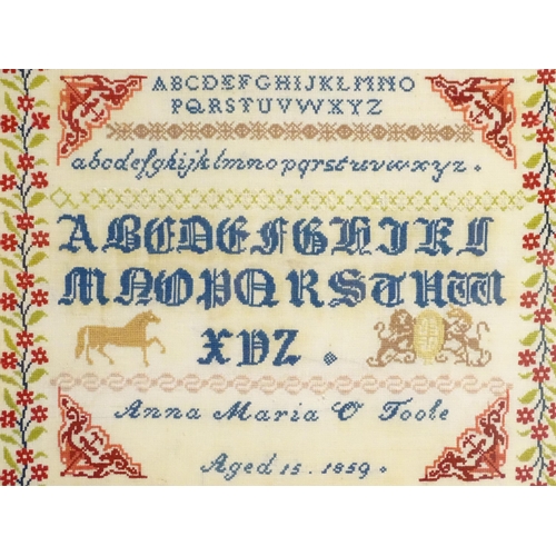 1984 - A needlework sampler embroidered with the letters of the alphabet, a horse and coat of arms, with a ... 