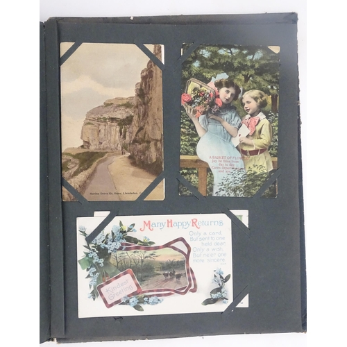 1970 - A Victorian scrapbook to include Christmas cards, greetings cards, scraps depicting cats, dogs, chil... 