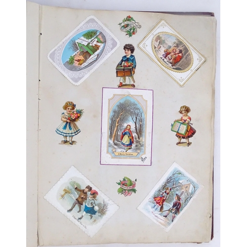 1970 - A Victorian scrapbook to include Christmas cards, greetings cards, scraps depicting cats, dogs, chil... 