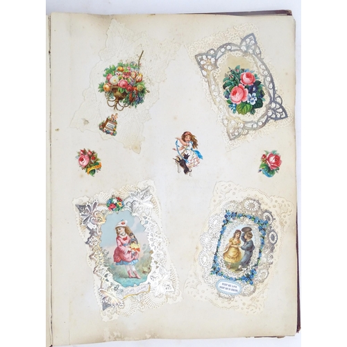 1970 - A Victorian scrapbook to include Christmas cards, greetings cards, scraps depicting cats, dogs, chil... 