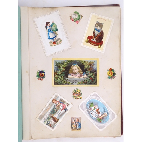 1970 - A Victorian scrapbook to include Christmas cards, greetings cards, scraps depicting cats, dogs, chil... 