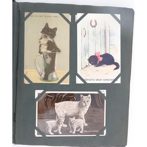 1970 - A Victorian scrapbook to include Christmas cards, greetings cards, scraps depicting cats, dogs, chil... 