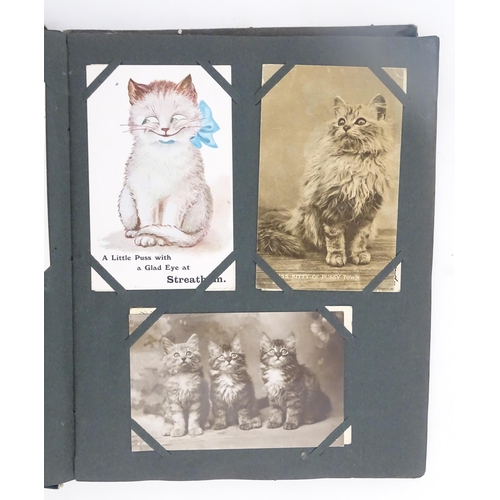 1970 - A Victorian scrapbook to include Christmas cards, greetings cards, scraps depicting cats, dogs, chil... 