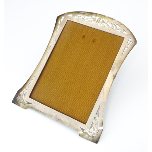 530 - A photograph frame with silver surround with openwork decoration hallmarked Birmingham 1916, maker L... 