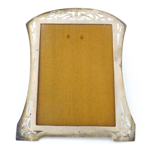 530 - A photograph frame with silver surround with openwork decoration hallmarked Birmingham 1916, maker L... 