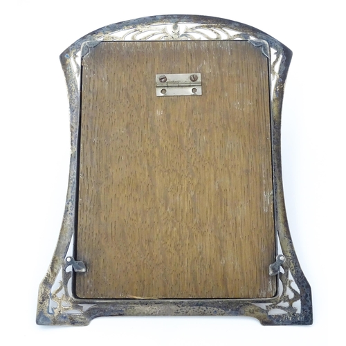 530 - A photograph frame with silver surround with openwork decoration hallmarked Birmingham 1916, maker L... 