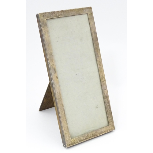 532 - An easel back photograph frame with silver surround hallmarked Birmingham 1920, maker Sanders & Mack... 